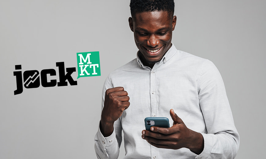 Man holding phone with Jock MKT logo