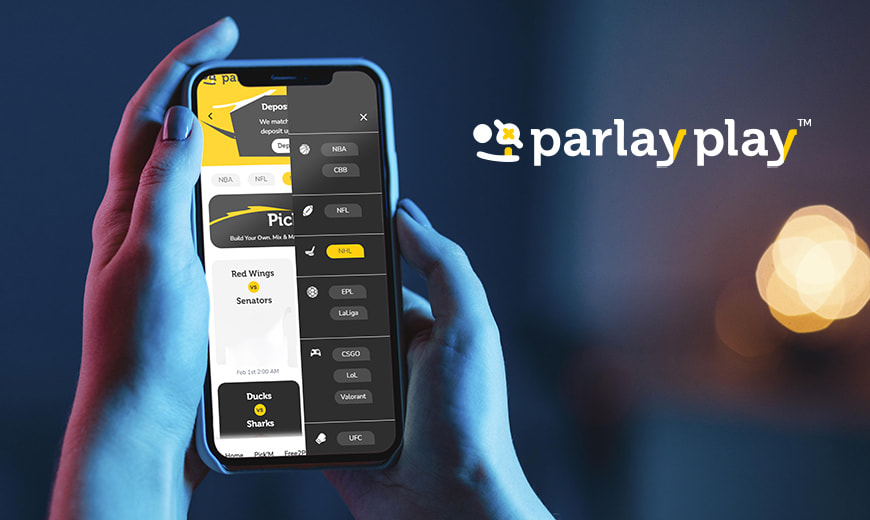 Hand holding phone with ParlayPlay app features on screen